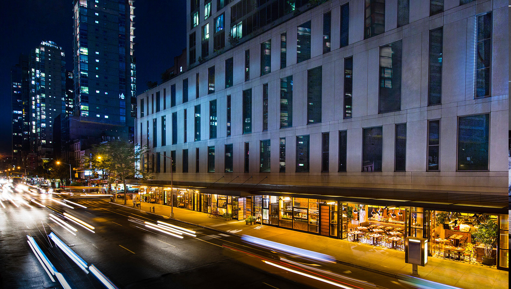 Kimpton Hotel Eventi sixth avenue entrance exterior with passing street cars