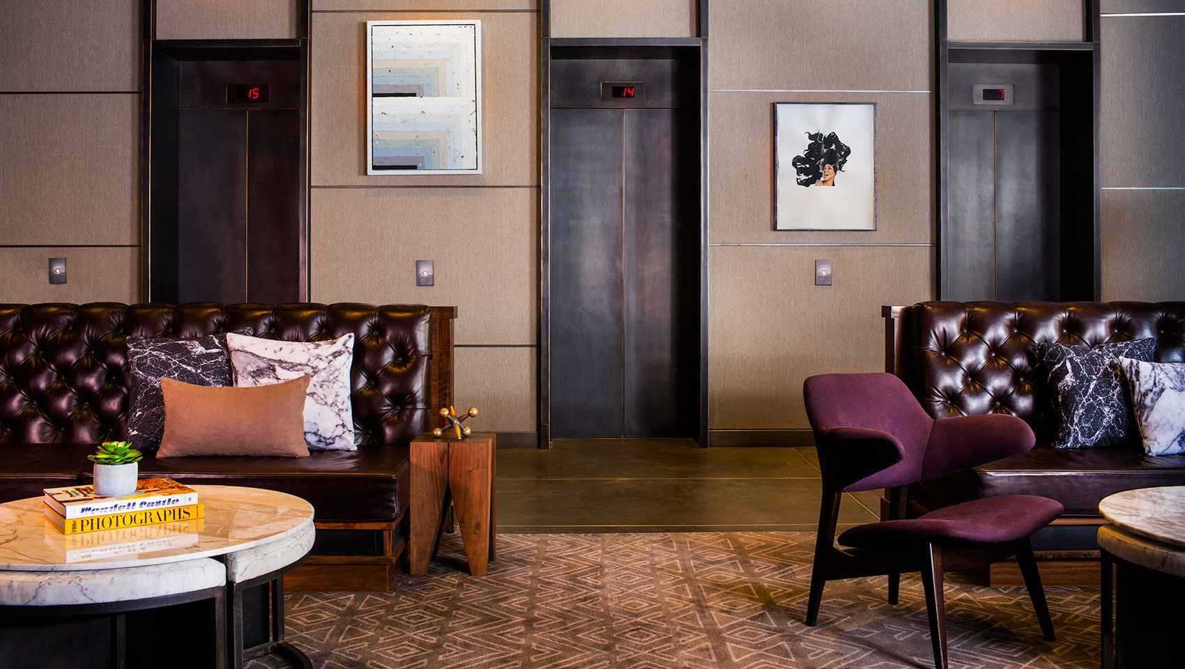 Kimpton Hotel Eventi lobby seating with 3 elevator doors behind