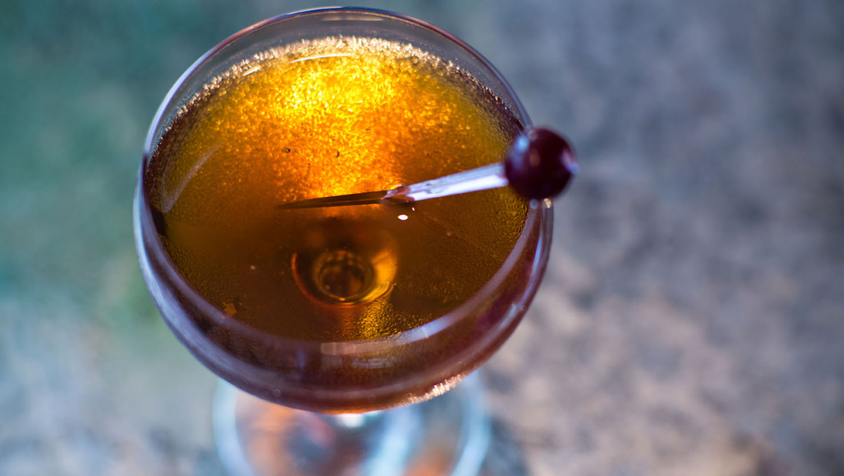 The Vine cocktail shown from above with stirrer placed in drink