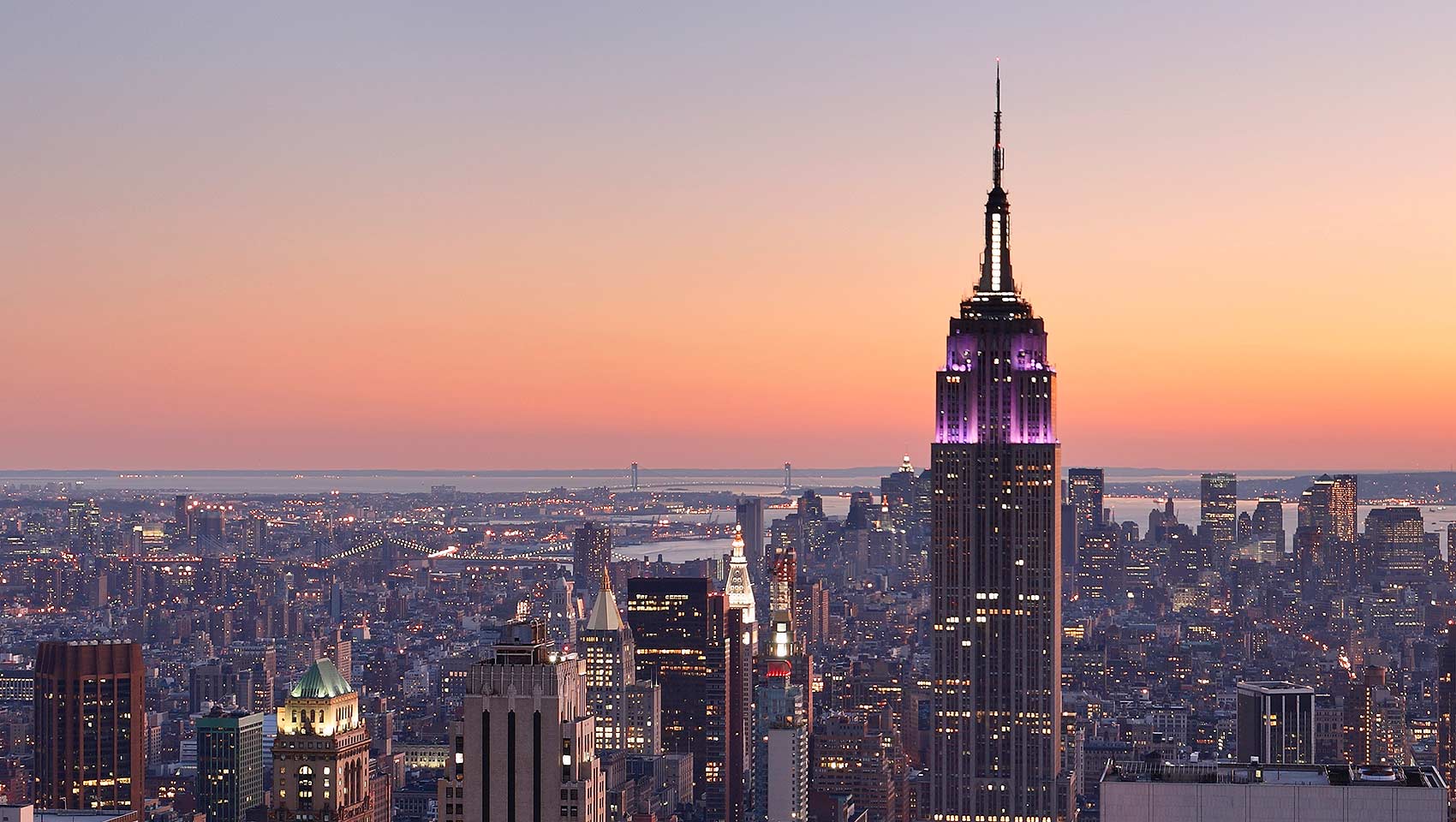 new york skyline at sunrise with pink sky